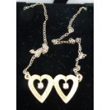 A 14ct gold double heart and white stone