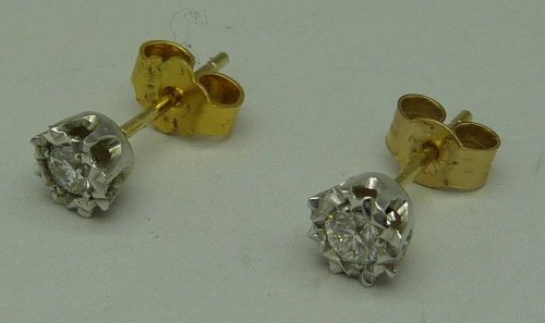 A pair of 9ct gold set diamond ear studs