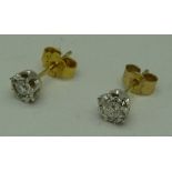 A pair of 9ct gold set diamond ear studs