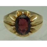 A 9ct gold and garnet ring, weight 3.5g,