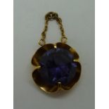 A yellow metal and amethyst pendant, wei