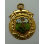 A 9ct gold enamelled golf fob medal, wit
