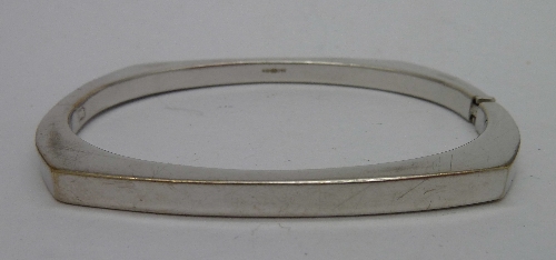 A 9ct white gold bangle, weight 14.1g