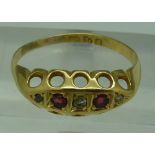 An 18ct gold, diamond and ruby ring, wei