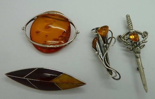 Three silver mounted brooches and a Scot