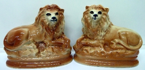 A pair of Staffordshire lions, a/f