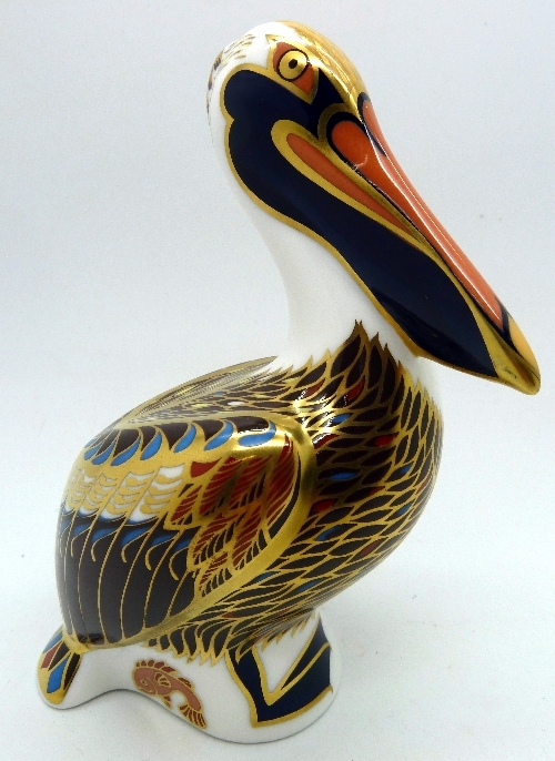 A Royal Crown Derby brown pelican paperweight with silver stopper