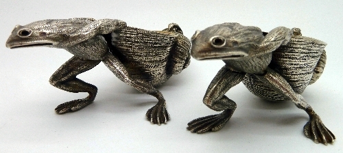 A pair of novelty salts in the form of frogs with shells