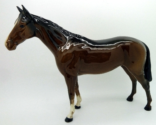 A Beswick horse, chip to ear and hoof