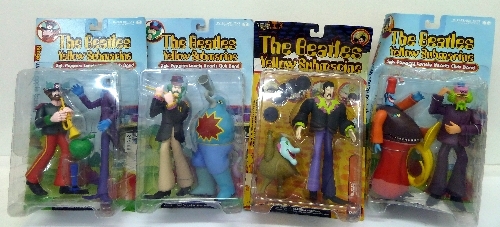 A set of four McFarlane Toys, The Beatles Yellow Submarine figures, in bubble packaging