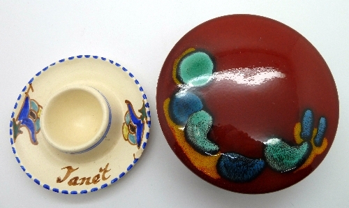 A Poole lidded pot and a Honiton pottery egg cup marked Janet