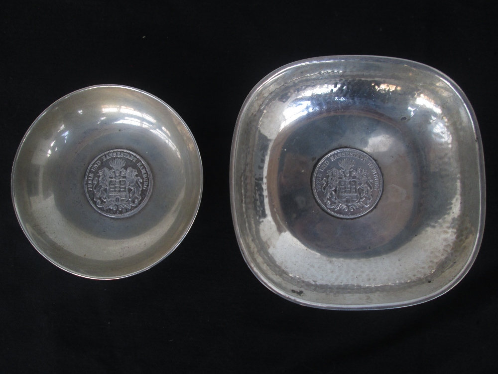 A German silver hand-textured bowl, the base inset with a Drei Mark 1911 silver coin, engraved to