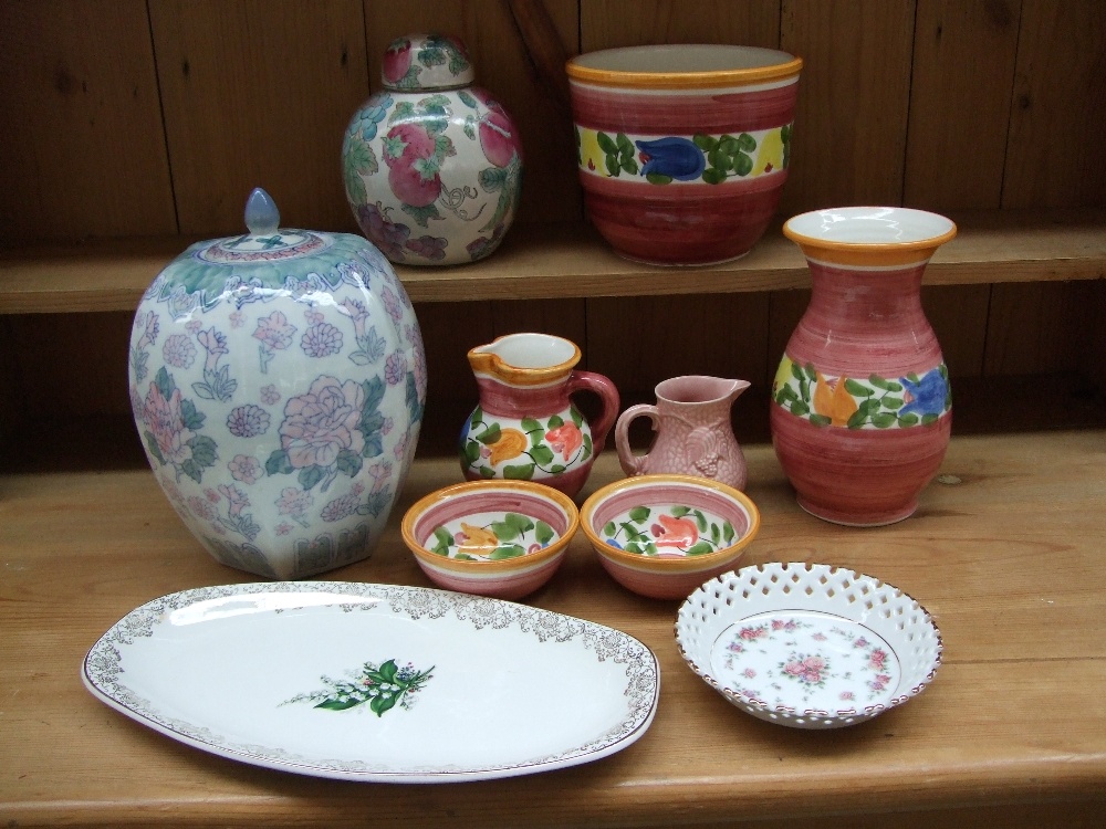 A quantity of stoneware and ceramics to include a vase, flower pot holder, jug and two small bowls