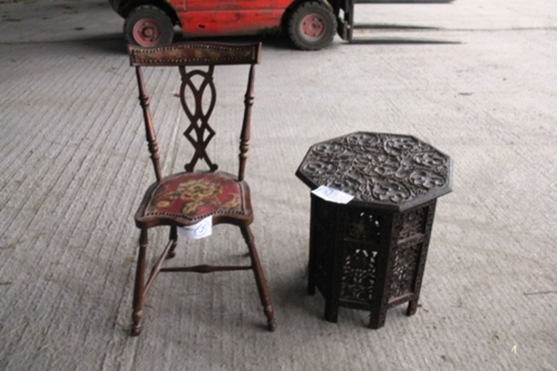 Deep carved oriental octagonal table with well carved leaf motif on 8 panel folding stand together