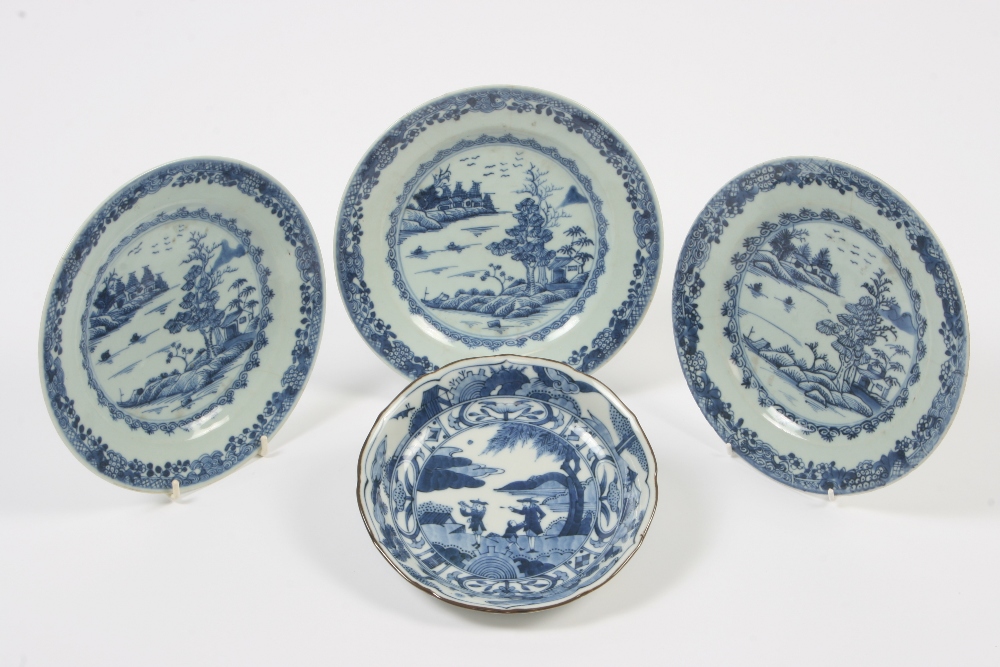 Three Nankin blue and white plates; and another having European decoration, (4) - see illustration