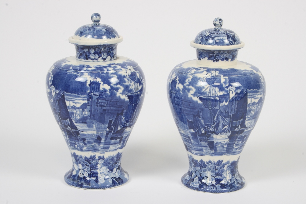 A pair of 19th Century Wedgwood Ferrara blue and white baluster vases and covers, decorated with