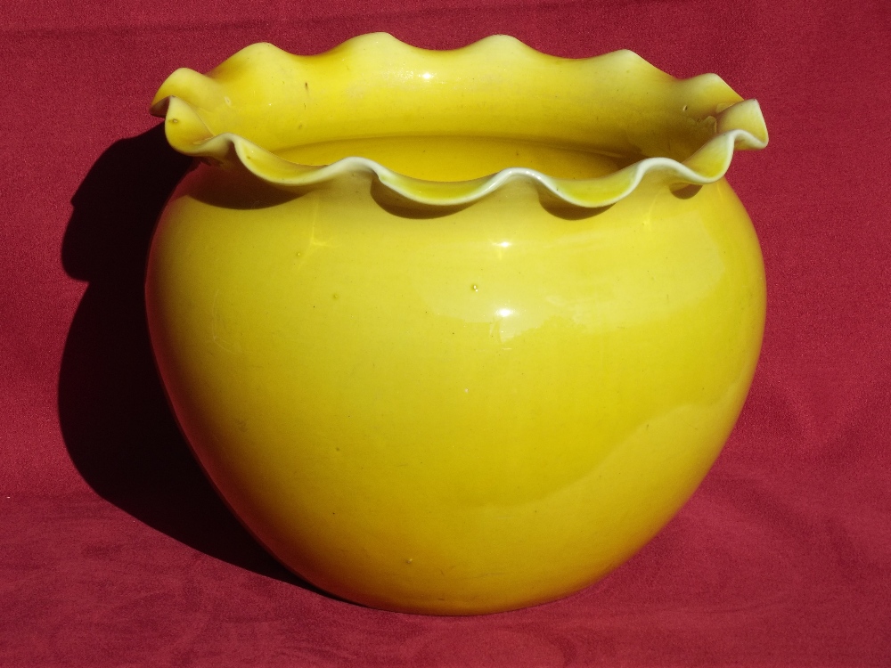 A canary yellow pottery jardiniere, having flared rim, possibly Mintons, 15.5cm high x 19cm dia.