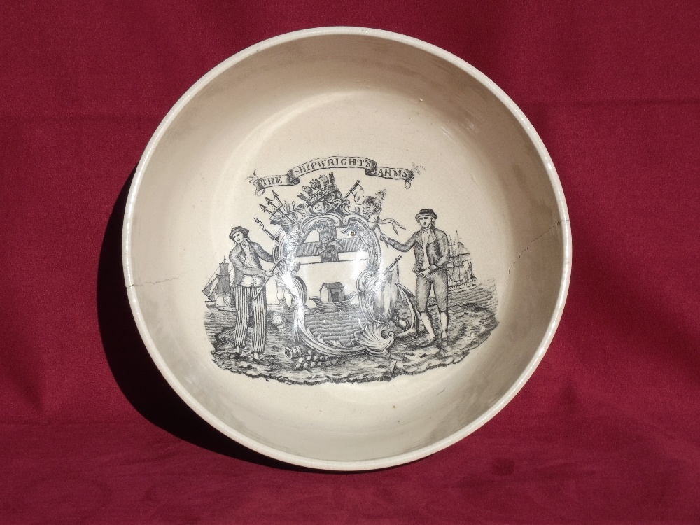 An early 19th Century transfer printed pottery bowl, decorated with the shipwright's arms and