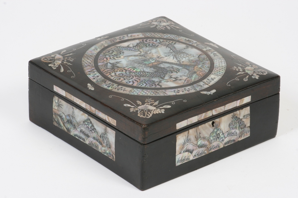 A Chinese hardwood trinket box, richly inlaid with mother of pearl decoration, 27.5cm x 28cm - see
