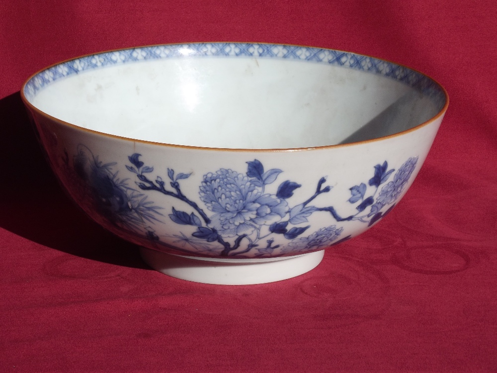 A 19th Century blue and white Chinese bowl, decorated with birds and foliage, 26cm dia.