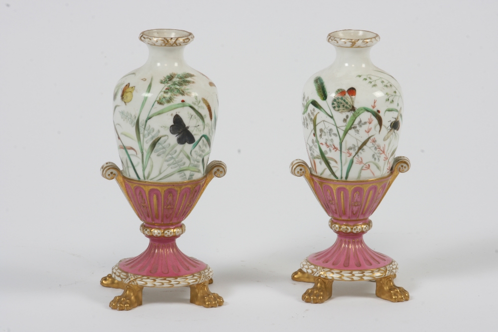 A pair of 19th Century Continental porcelain vases, of baluster form, profusely painted with flowers