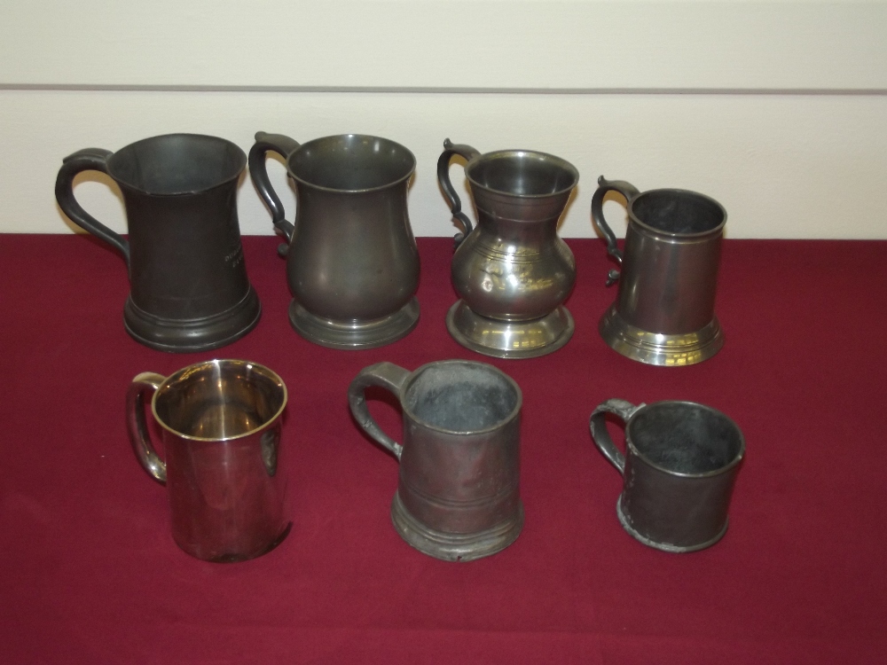 A 19th Century pewter baluster shaped two gill mug; a straight sided one gill pewter mug; a four