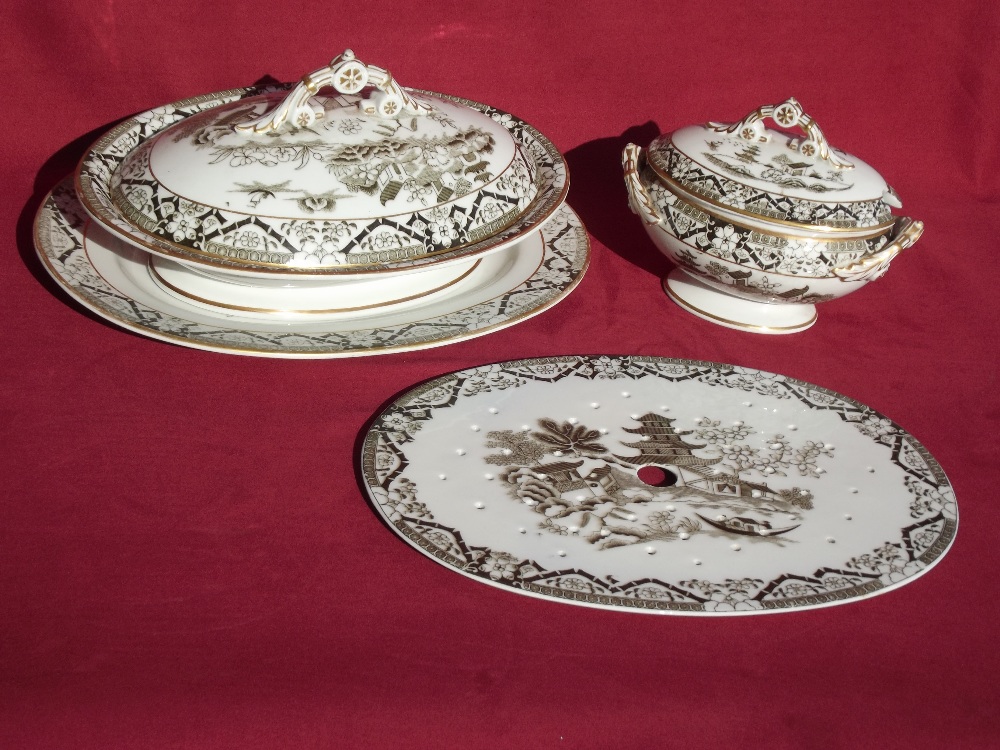 A Grainger Worcester extensive late Victorian dinner service, decorated in the Chinese manner with