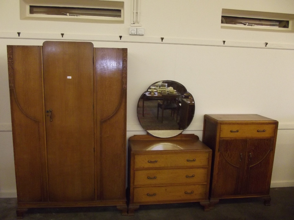 A 20th Century oak veneered three piece bedroom suite, comprising single door wardrobe 186cm x