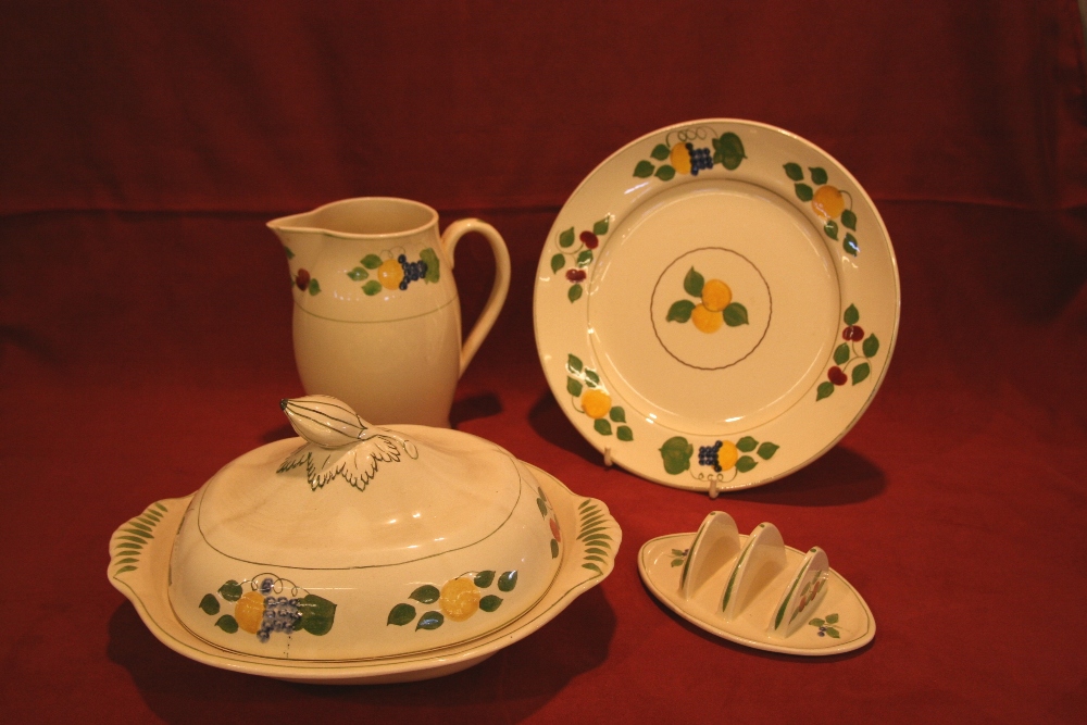 An extensive collection of Adams Titian ware hand painted dinner and teaware, comprising tureen,