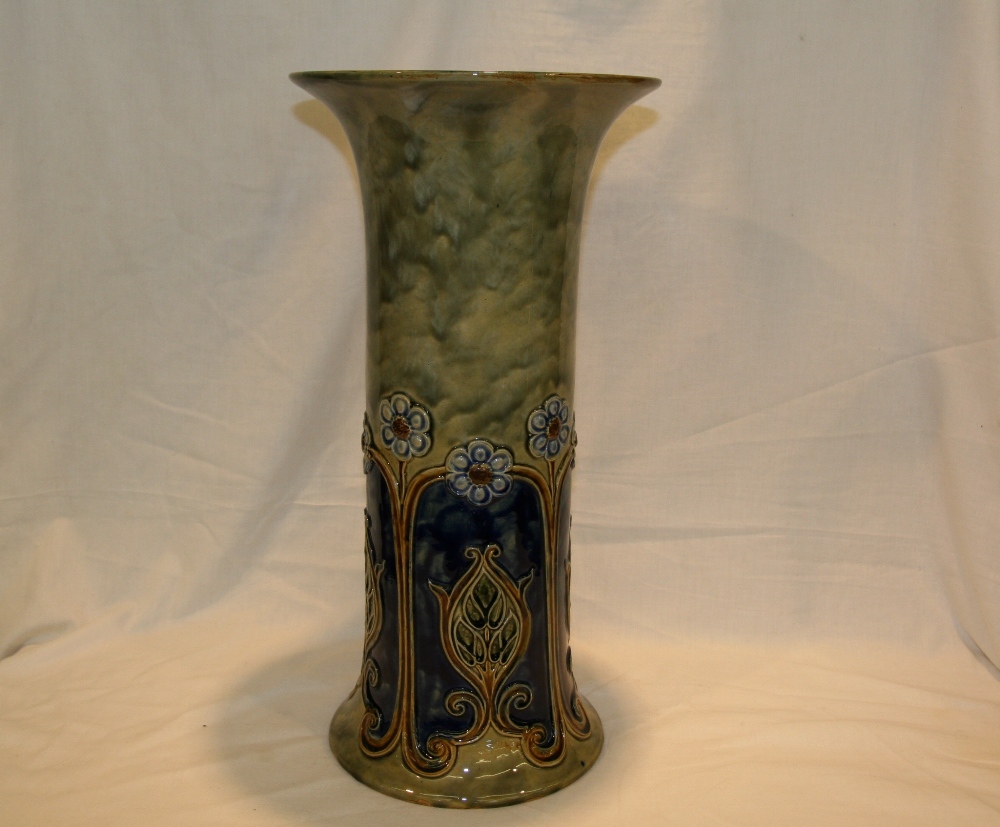 A Royal Doulton stick stand, decorated with stylised flowers on blue and green ground, marked to