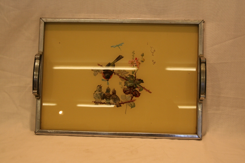 An Art Deco twin handled tea tray, decorated with birds, 32cm x 45cm