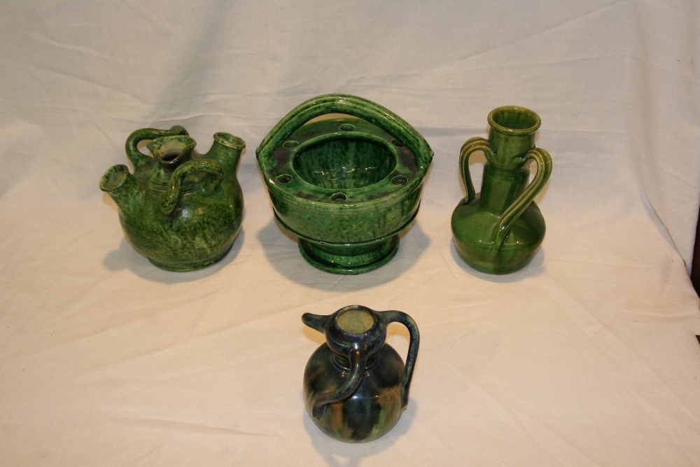 A collection of Art Nouveau pottery, to include green glazed flower basket with pierced rim; two tri