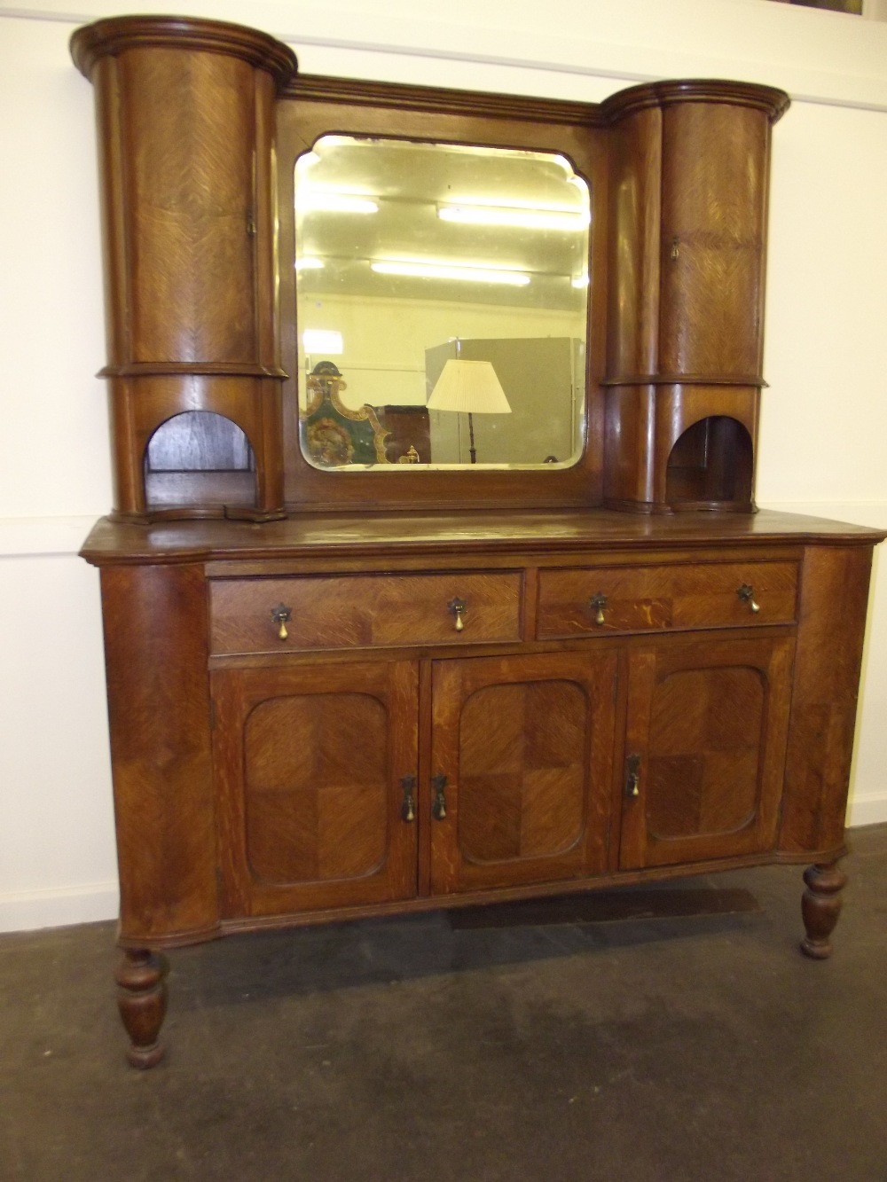 An early 20th Century oak mirrored back sideboard, 186cm x 152cm AF