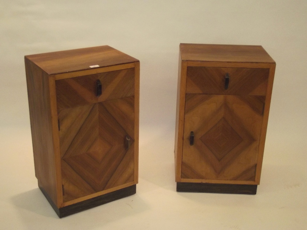 A pair of Art Deco walnut veneered bedside cupboards, fitted single drawer above, 68cm x 40cm