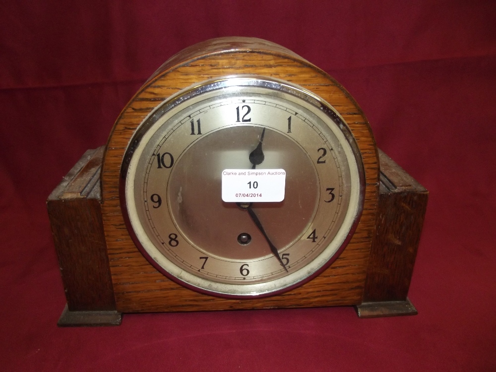 An early 20th Century oak cased single hole mantel clock, 20cm