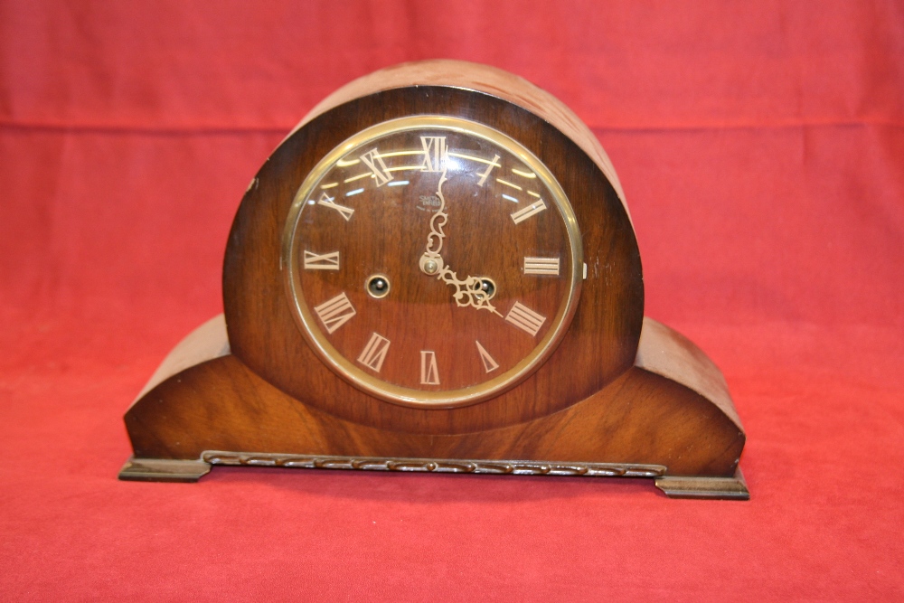 A Smiths Enfield mahogany cased two hole mantel clock, 23cm