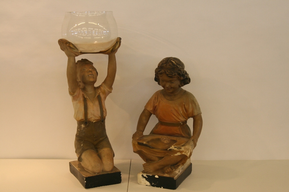 A plaster figure of a kneeling young boy, holding aloft clear glass bowl, 72cm; and a plaster figure