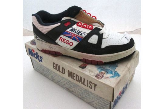 A pair of Vintage Nicks Rego Gold Medalist black and white trainers size 7,  c/w original box.