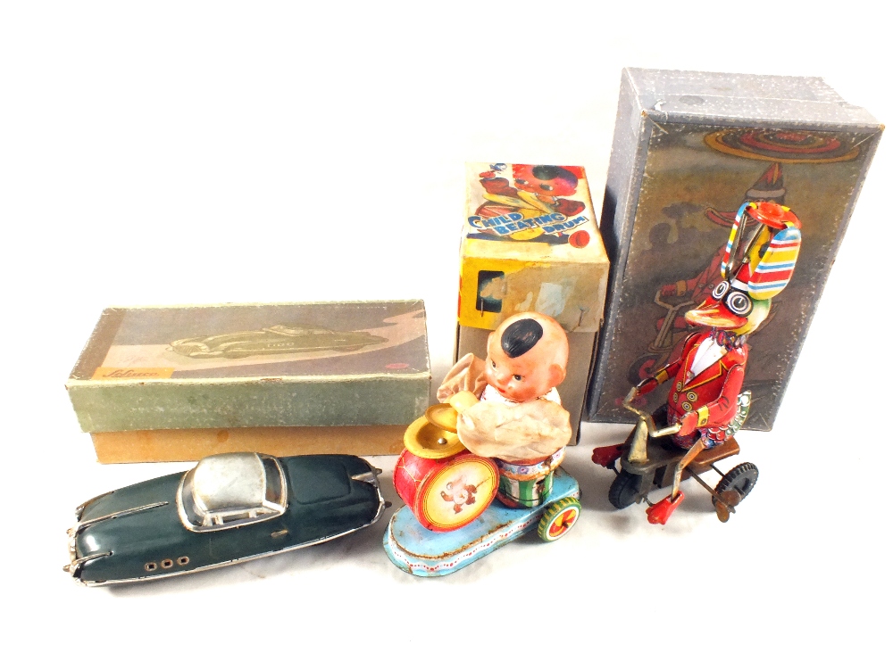 A Schuco tin plate saloon and two other tin plate models (all boxed)