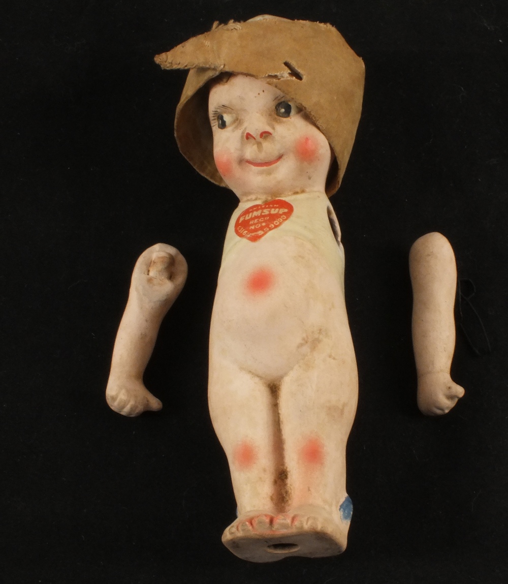 A porcelain Fumsup doll
