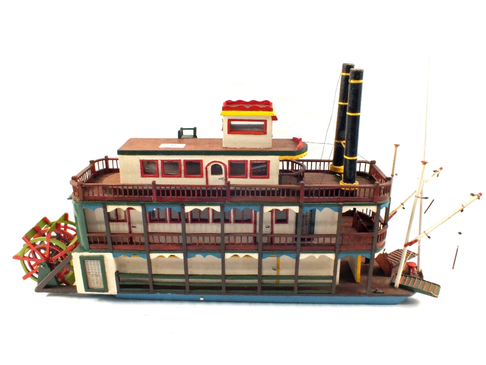 A wooden model of a paddle steamer