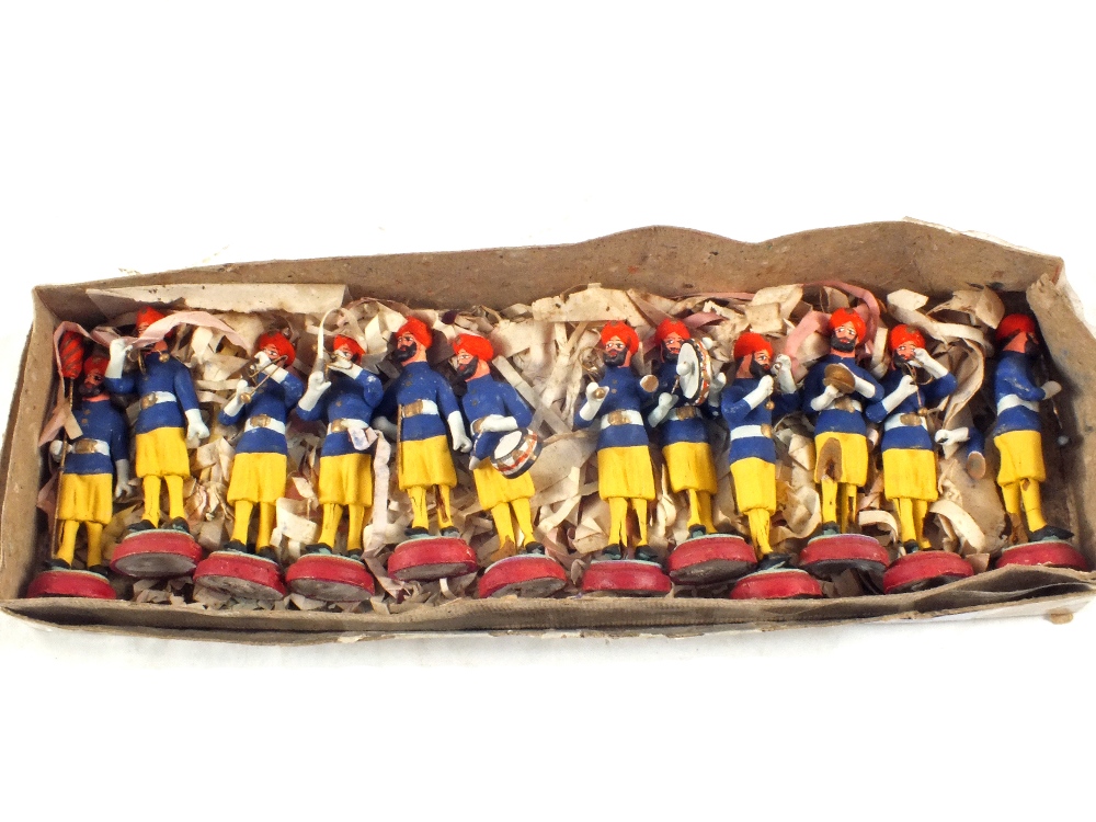 A boxed set of Indian clay models of bandsmen