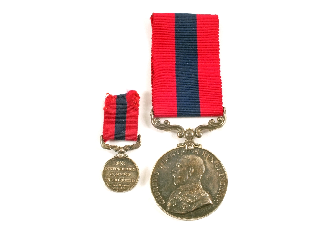 A distinguished Conduct medal (George V) name erased, together with miniature