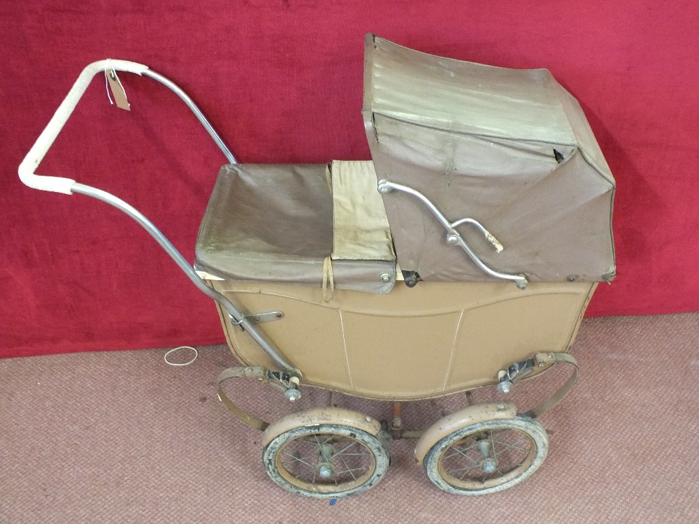 A vintage Triang brown dolls pram