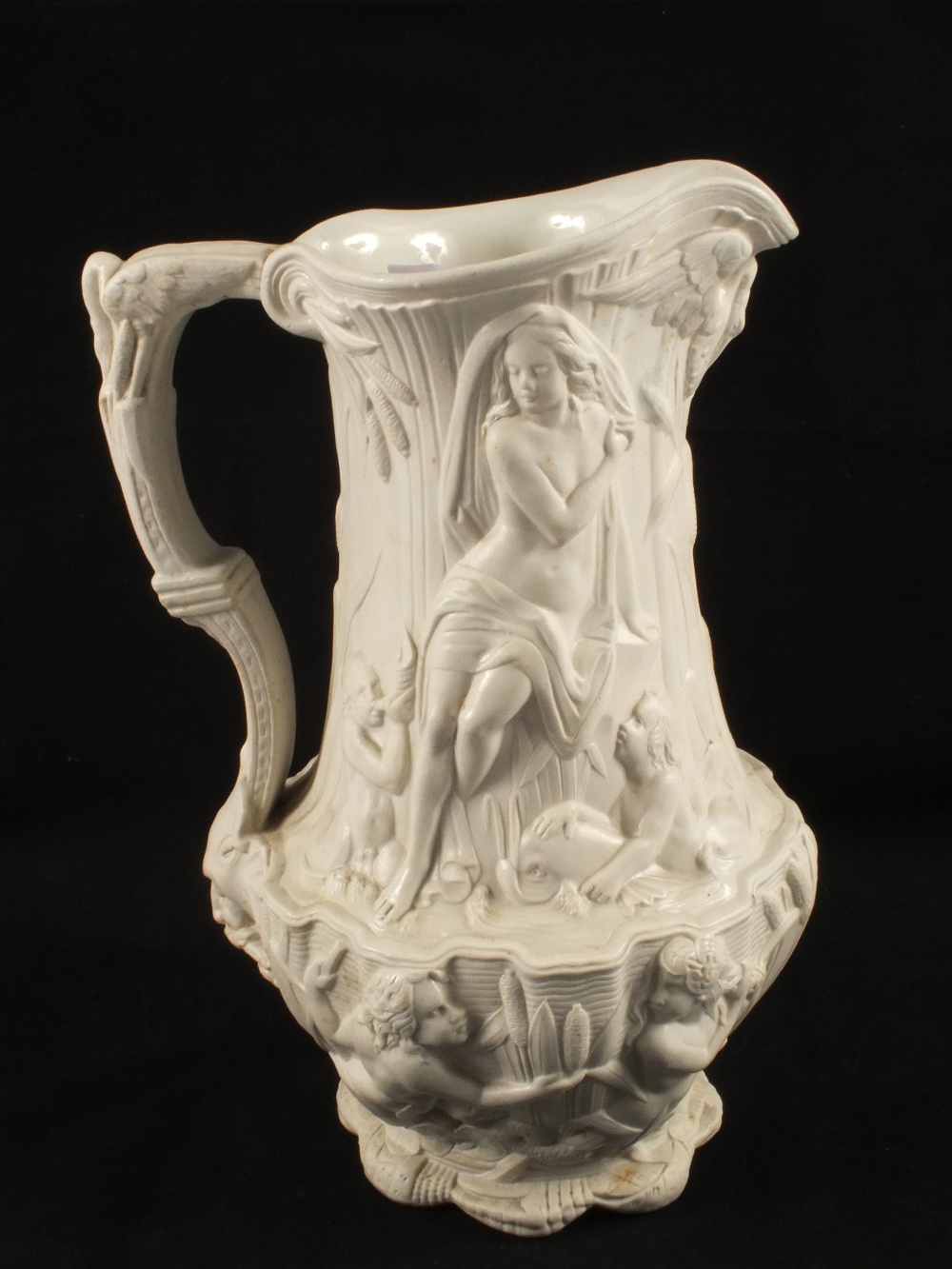 A Victorian Staffordshire stoneware relief moulded jug with woman and children decoration, height