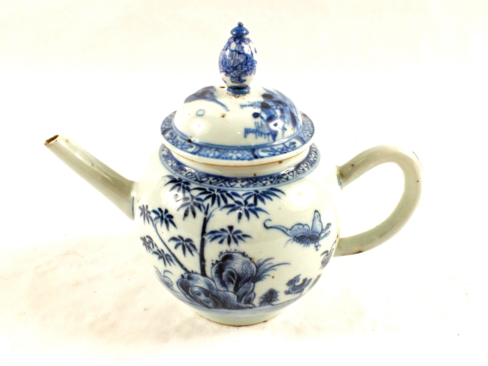 An 18th Century Nankin teapot with butterfly decoration (old restorations)