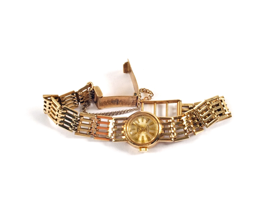 A lady`s 9ct Gold Rotary wristwatch and strap