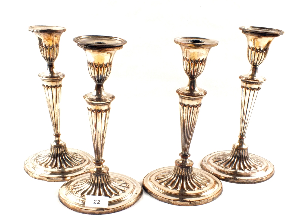 A set of four Silver plated on Copper reeded column candlesticks