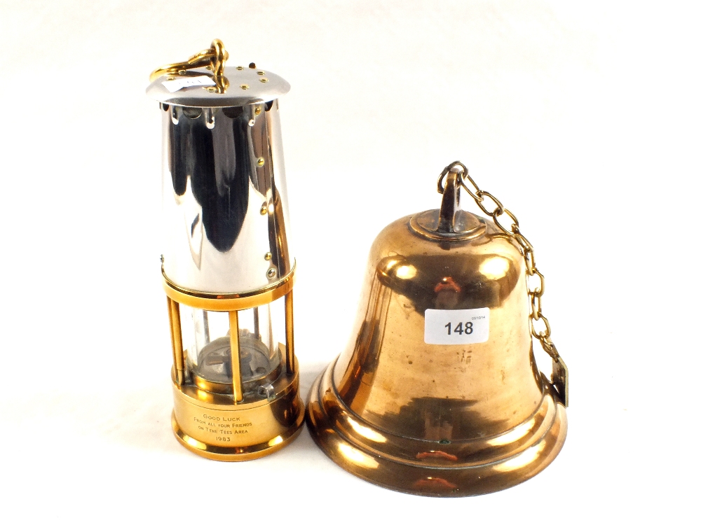 A Brass miners lamp by Protector Lamp & Lighting Co, Eccles and a Brass bell