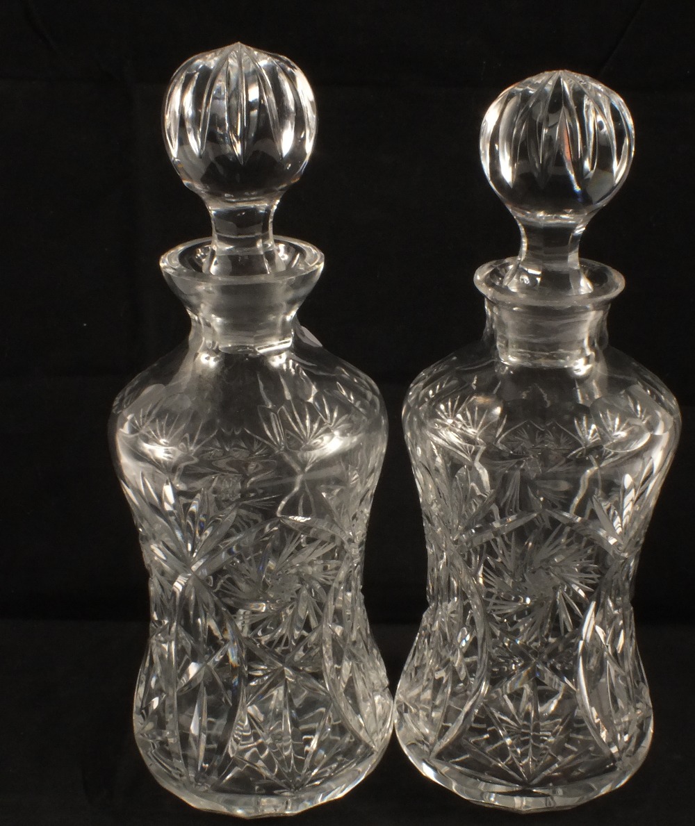 A pair of cut glass decanters